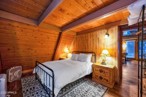 a view of a porch with wooden floor