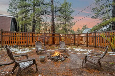 a view of backyard with a table and chairs