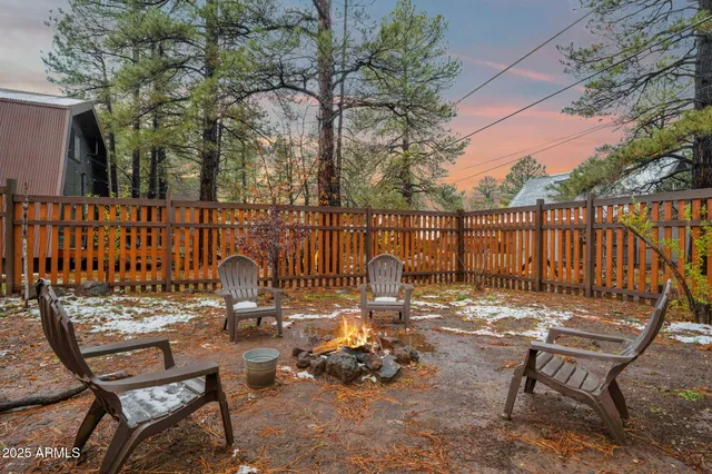 a view of backyard with a table and chairs