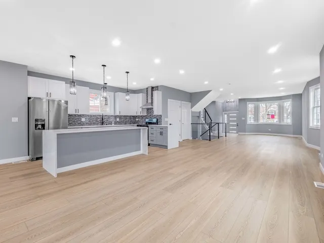 a view of kitchen with wooden floor and window