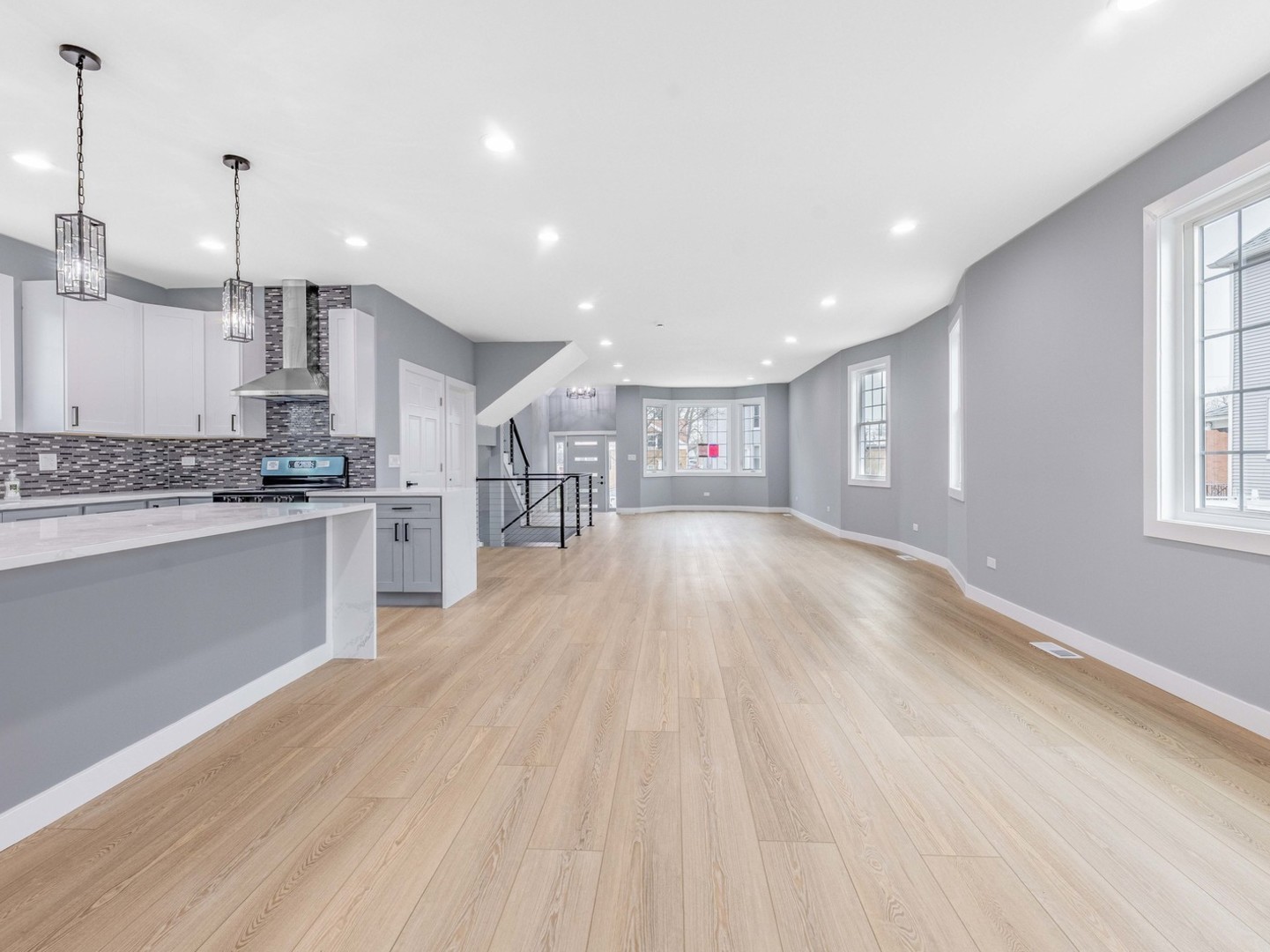 3548 Clinton Avenue Berwyn, IL 60402 - Photo 12 of 49 a kitchen with stainless steel appliances granite countertop a sink a stove and a wooden floors