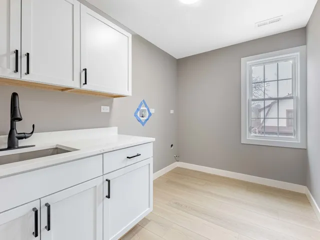 a view of a kitchen with cabinets