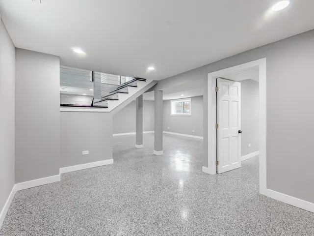 a view of a livingroom with an empty space and a window
