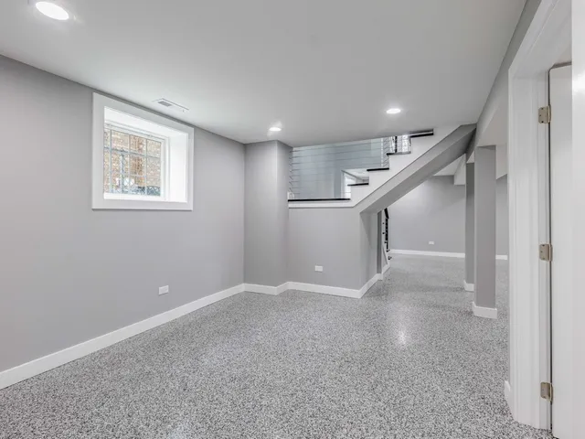 a view of an empty room with stairs