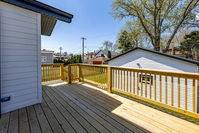 a view of balcony with wooden floor