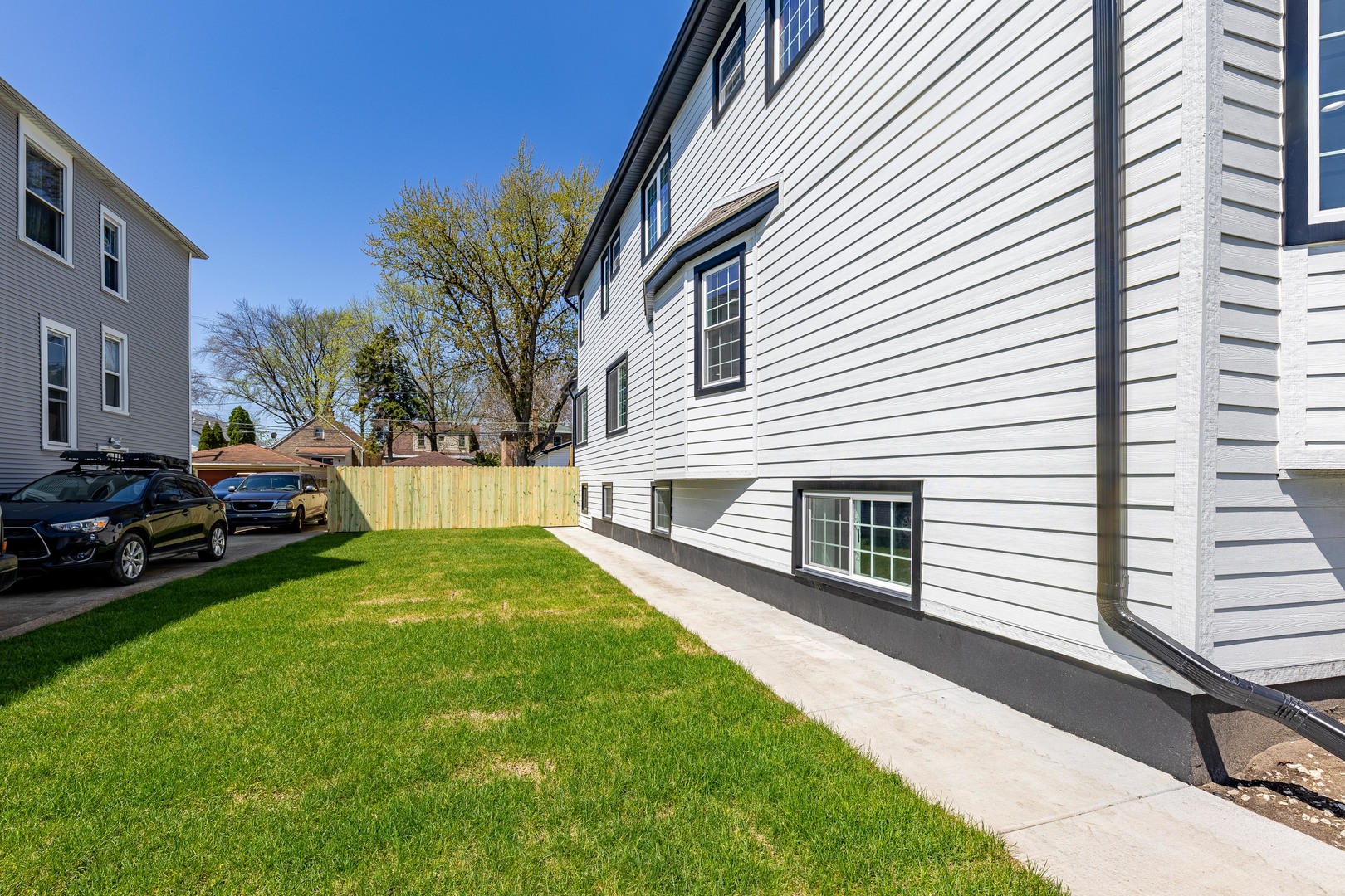 3548 Clinton Avenue Berwyn, IL 60402 - Photo 48 of 49 a view of a white house with a yard