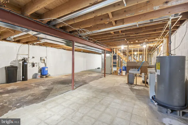a view of storage and utility room with racks on the wall