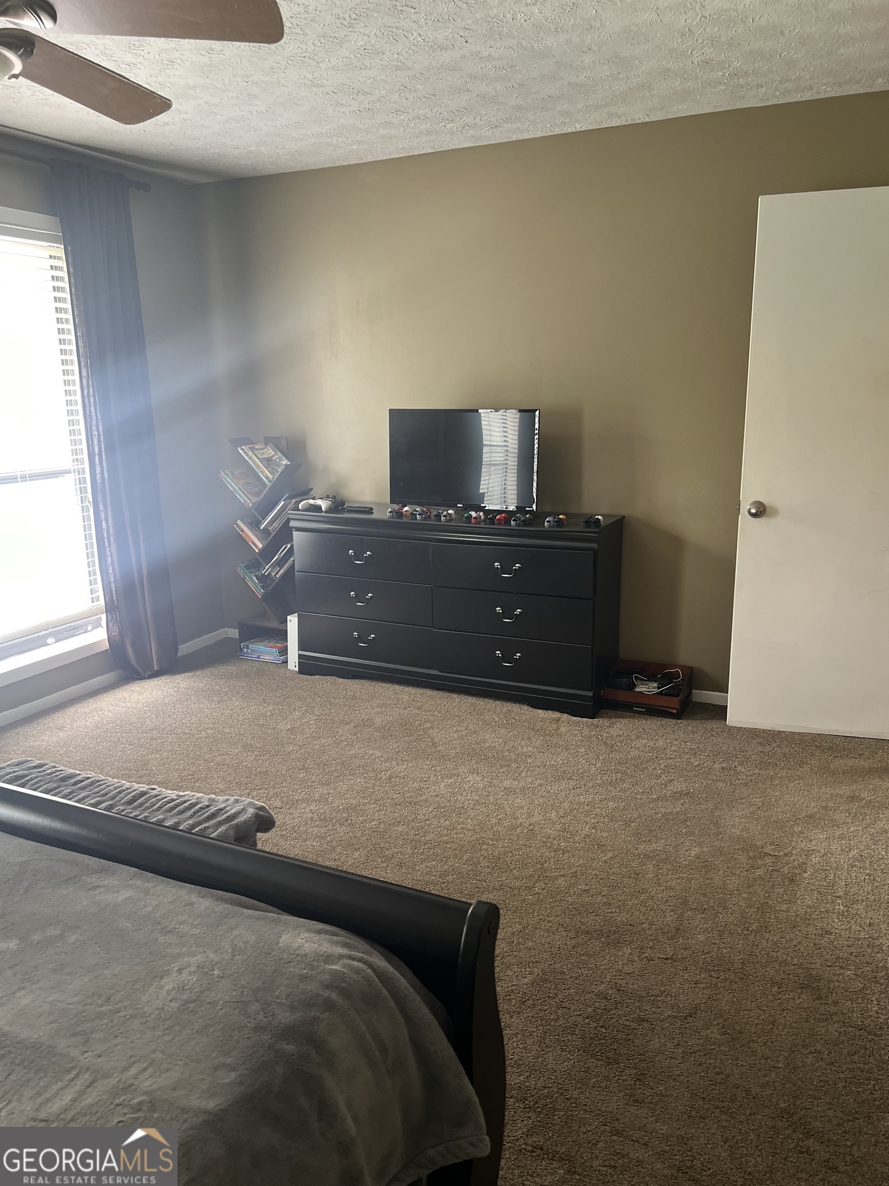 709 Wynnes Ridge Circle Marietta, GA 30067 - Photo 4 of 11 a bedroom with a bed and window