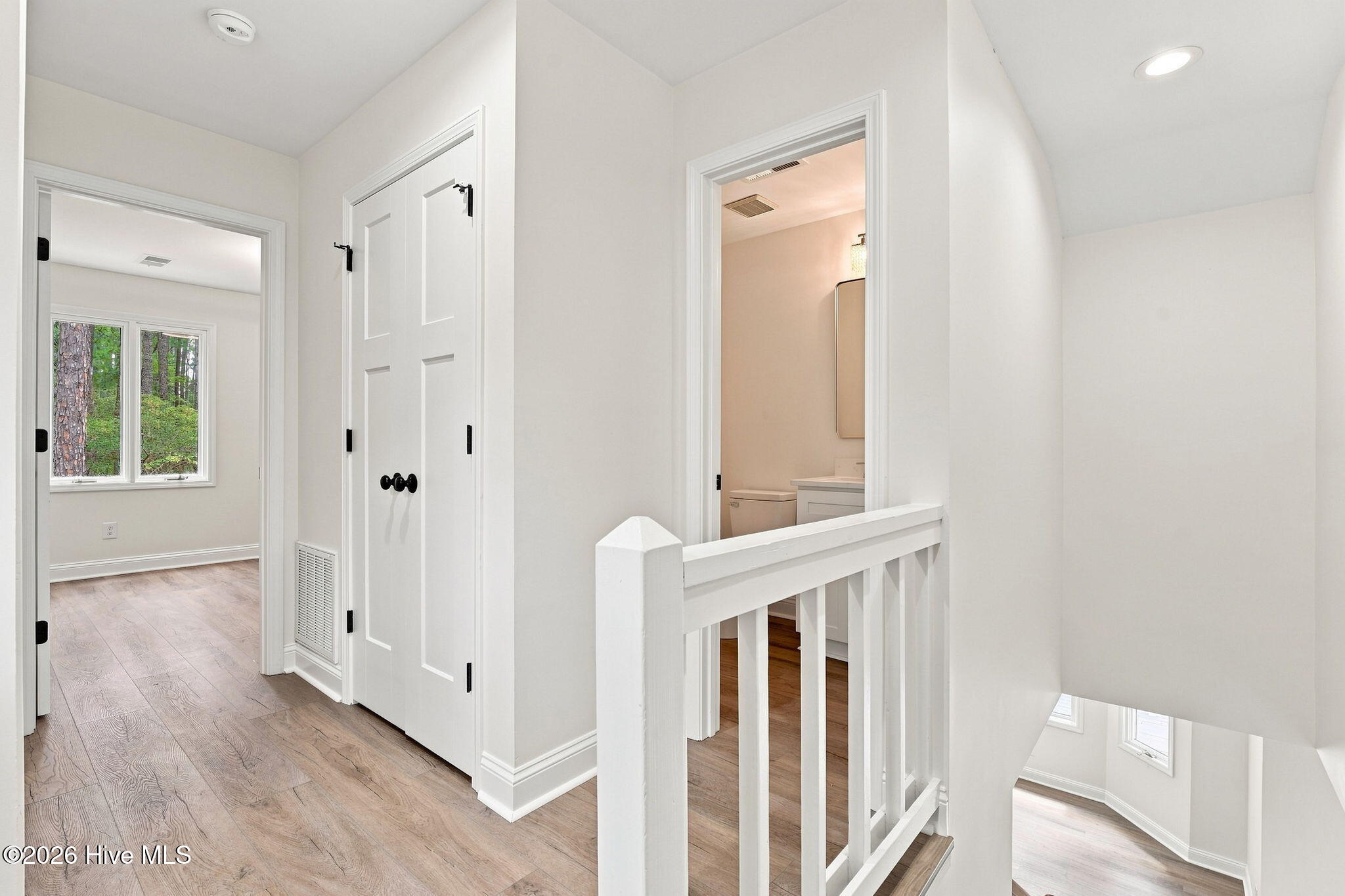 611 Sun Road Aberdeen, NC 28315 - Photo 26 of 59 Upstairs hallway with large linen closet with new shelving