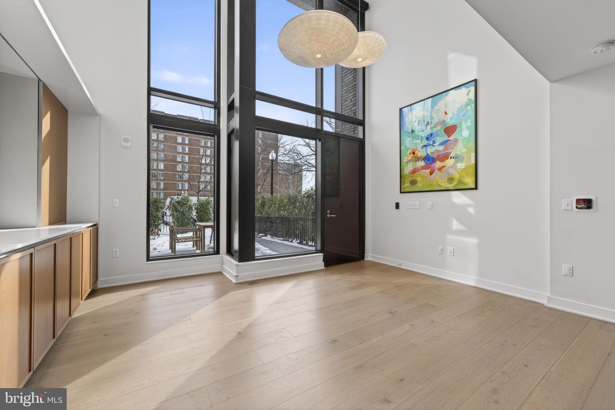 1332 8th Street Northwest Washington, DC 20001 - Photo 5 of 46 a view of an empty room with a window