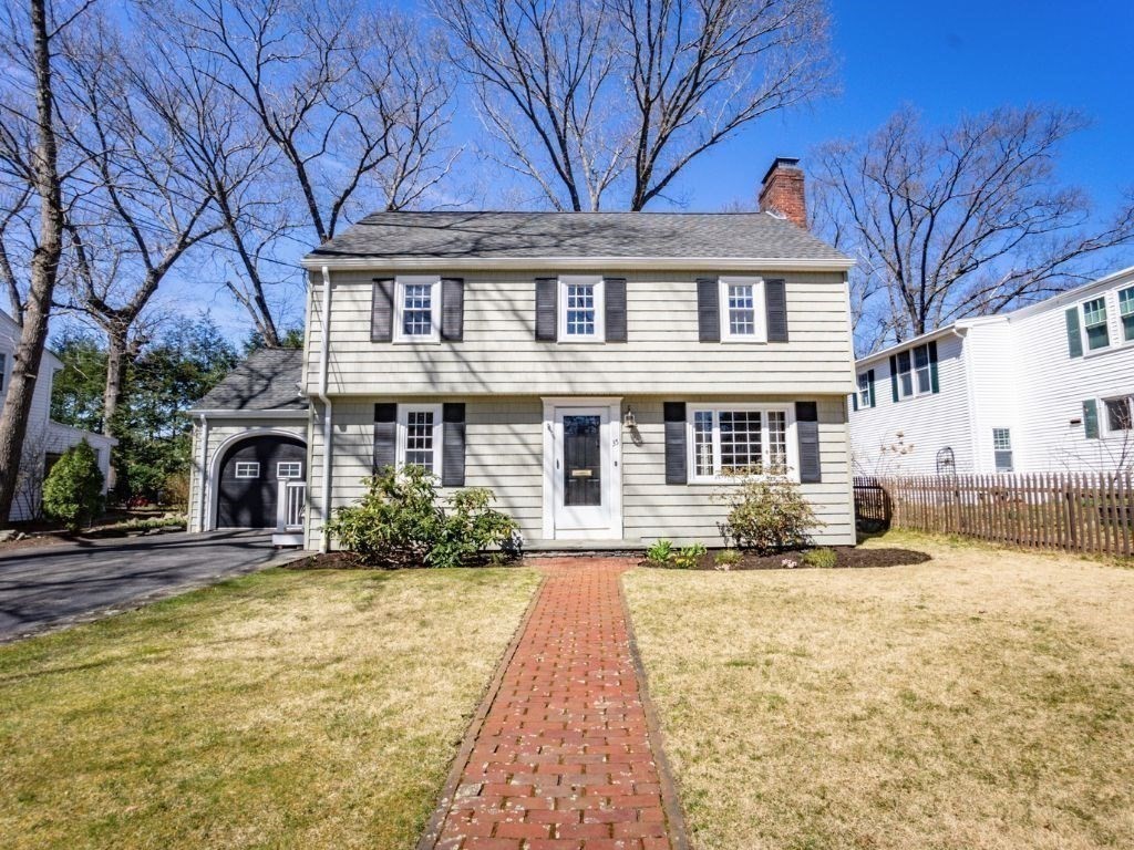 35 Hamilton Road Waltham, MA 02453 - Photo 3 of 38 a front view of a house with a yard