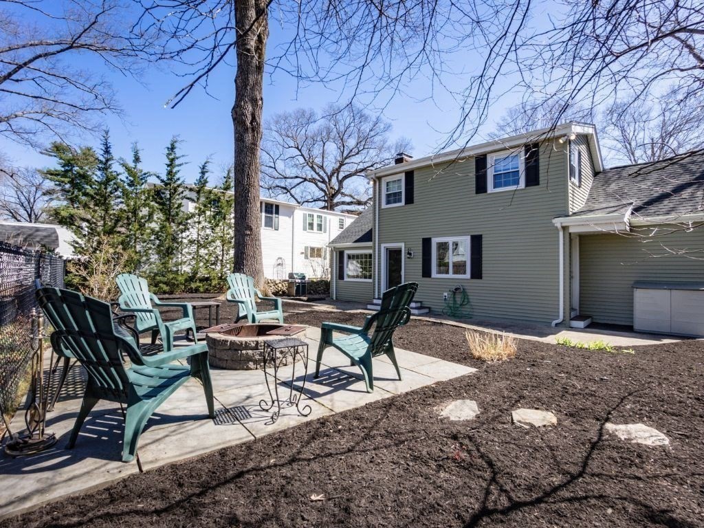 35 Hamilton Road Waltham, MA 02453 - Photo 31 of 38 a backyard of a house with table and chairs