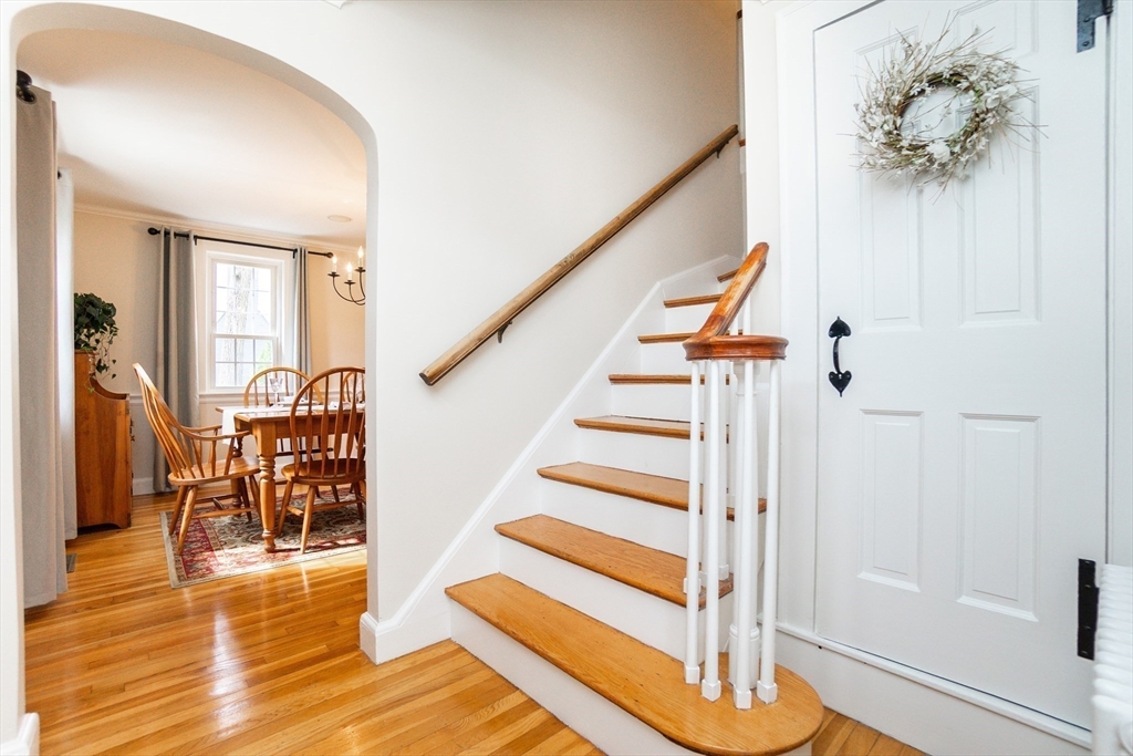 35 Hamilton Road Waltham, MA 02453 - Photo 6 of 38 a view of entryway with wooden floor and stairs