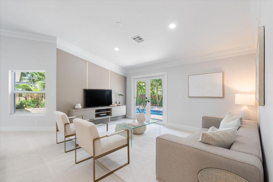 1132 Northeast 3rd Avenue Boca Raton, FL 33432 - Photo 8 of 25 a living room with furniture and a flat screen tv