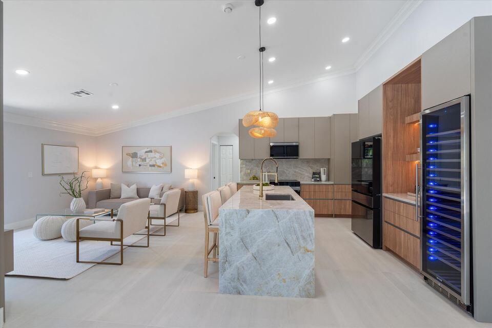 1132 Northeast 3rd Avenue Boca Raton, FL 33432 - Photo 10 of 25 a large living room with stainless steel appliances furniture a rug and a view