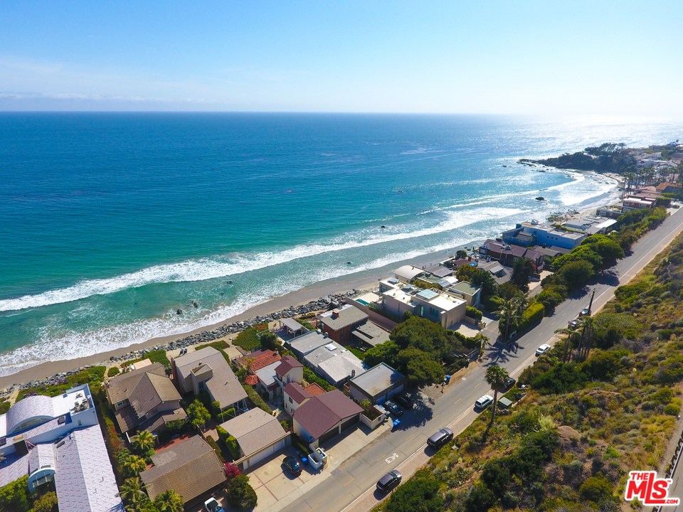 an aerial view of beach and ocean