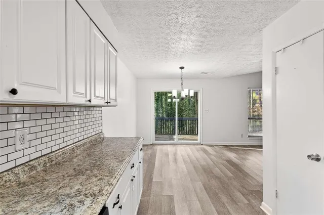 a view of a water heater room with a ceiling fan