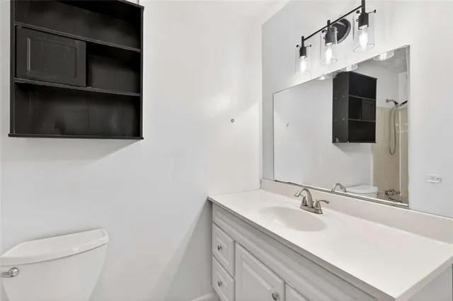 a view of a balcony with wooden floor and fence