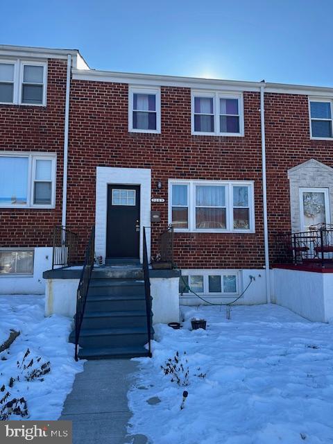 5009 Gateway Terrace Baltimore, MD 21227 - Photo 1 of 1 a front view of a house with garden