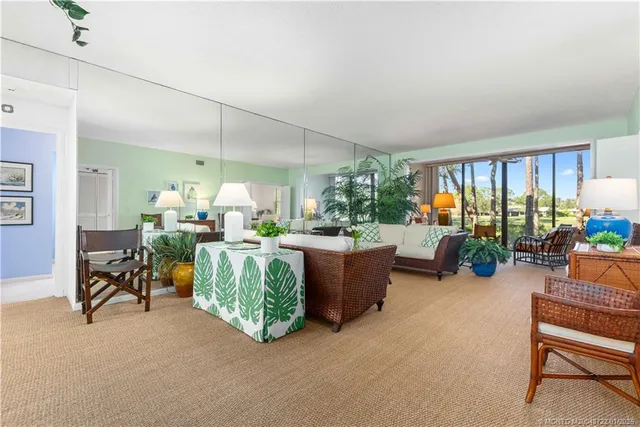 a living room filled with furniture and a table