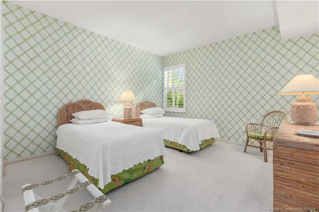 a bedroom with double bed and a lamp