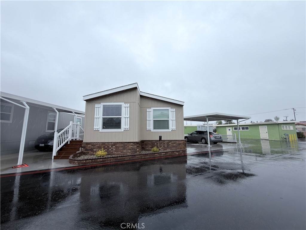 a living room with furniture a rug and a wooden floor