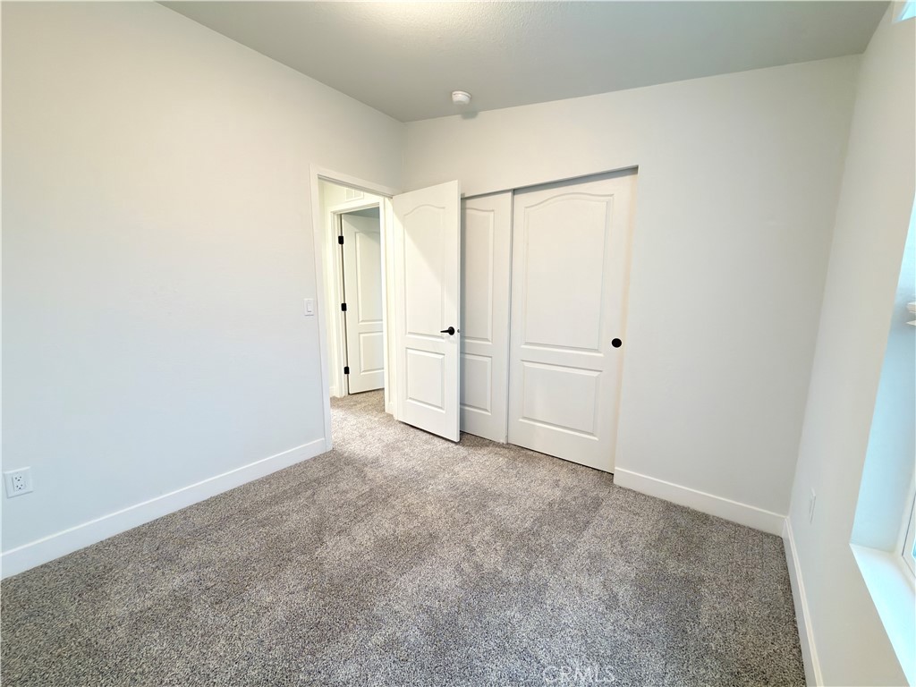 13061 Fairview Street, Unit 22 Garden Grove, CA 92843 - Photo 14 of 25 an empty room with closet area