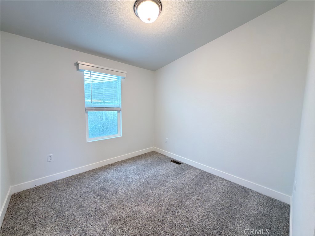 13061 Fairview Street, Unit 22 Garden Grove, CA 92843 - Photo 15 of 25 an empty room with a window