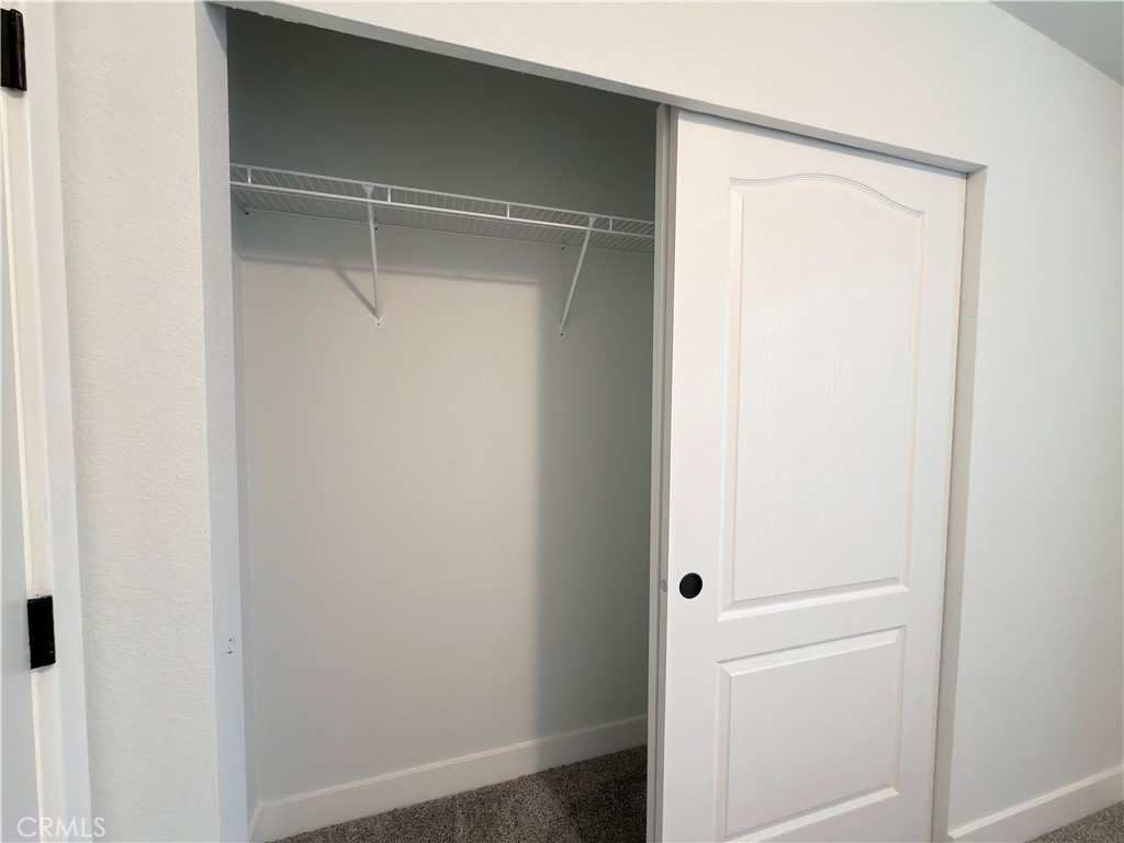 13061 Fairview Street, Unit 22 Garden Grove, CA 92843 - Photo 17 of 25 a bathroom with a glass shower door