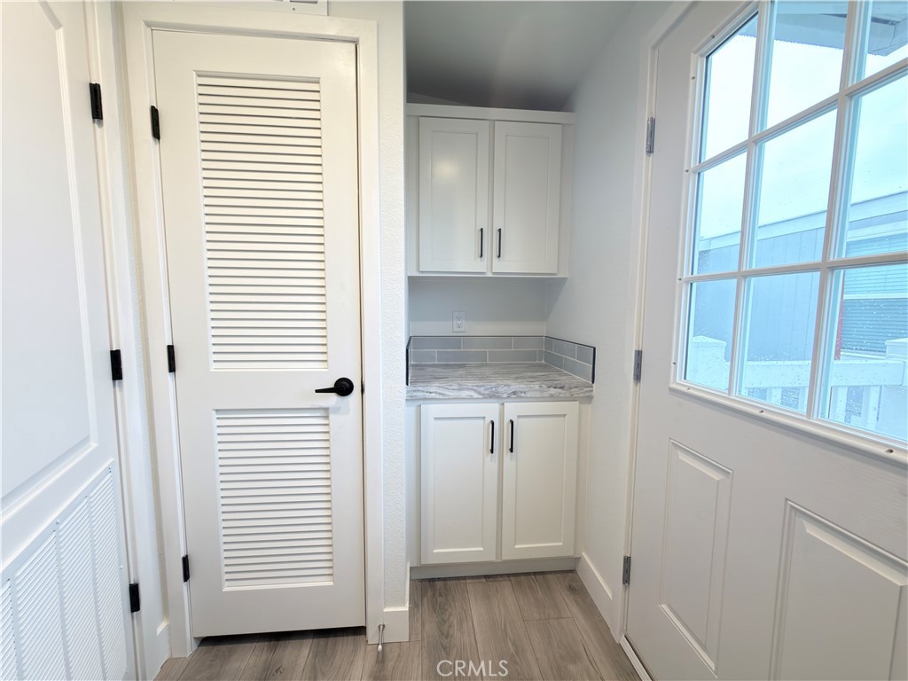 13061 Fairview Street, Unit 22 Garden Grove, CA 92843 - Photo 24 of 25 a view of a kitchen from the hallway with a window