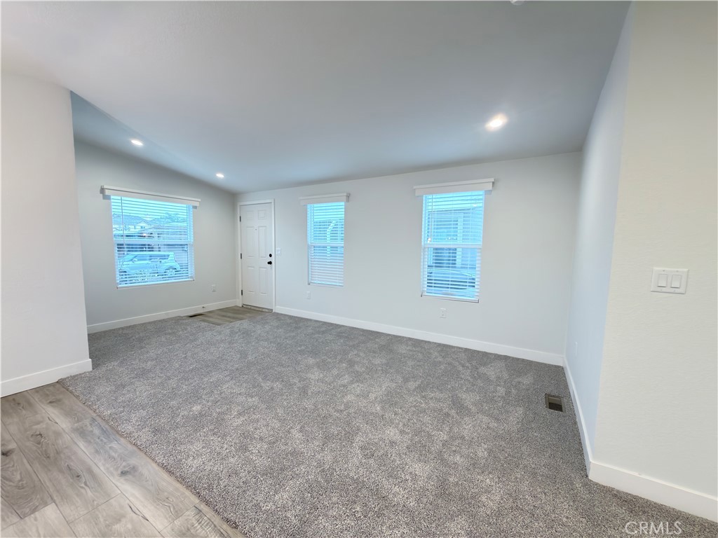 13061 Fairview Street, Unit 22 Garden Grove, CA 92843 - Photo 10 of 25 an empty room with windows