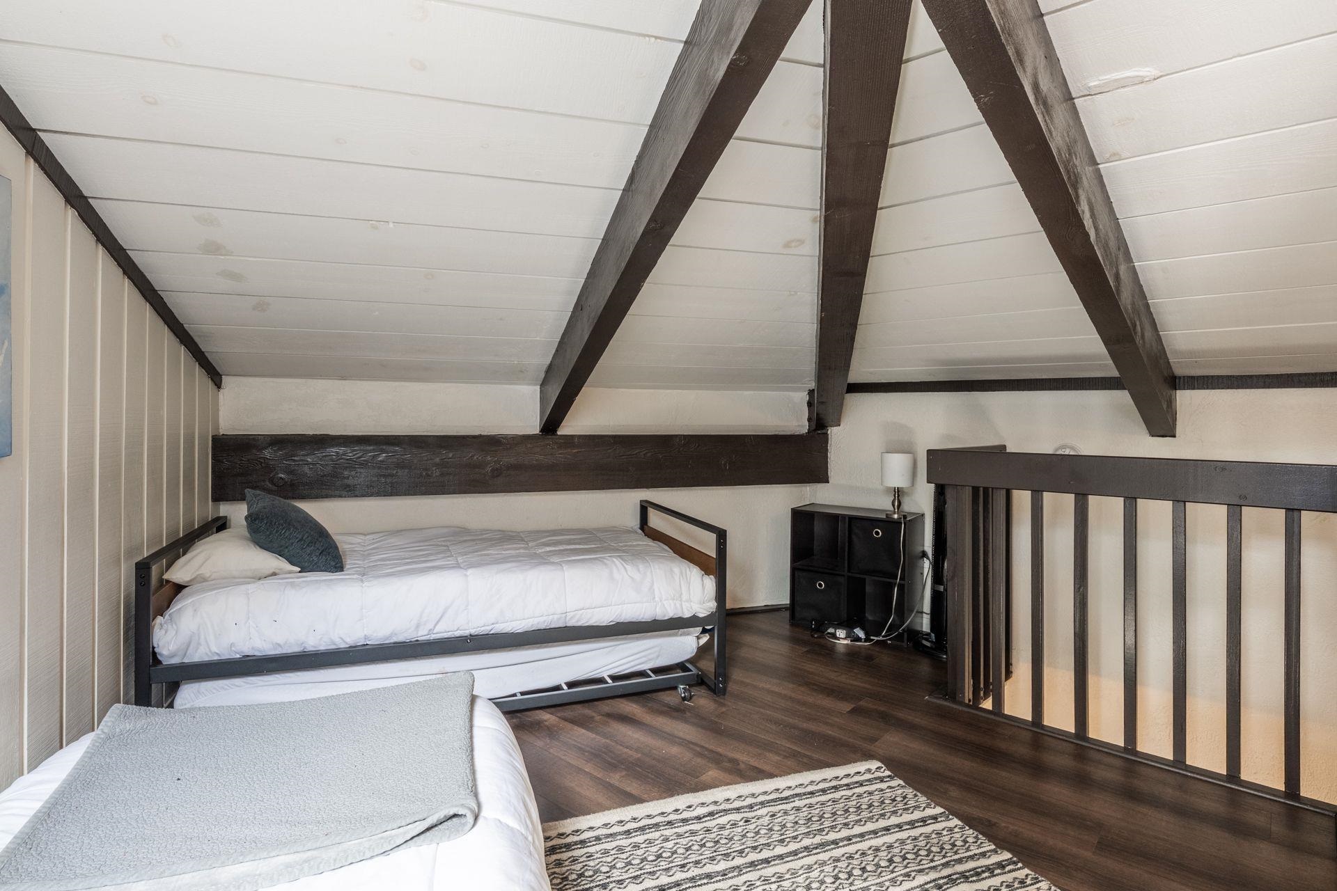 286 Old Mammoth Road, Unit 71 Mammoth Lakes, CA 93546 - Photo 19 of 24 a bedroom with a bed and a window
