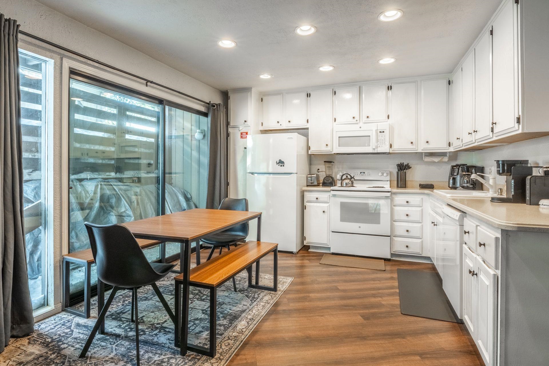 286 Old Mammoth Road, Unit 71 Mammoth Lakes, CA 93546 - Photo 5 of 24 a kitchen with a stove a refrigerator and a sink