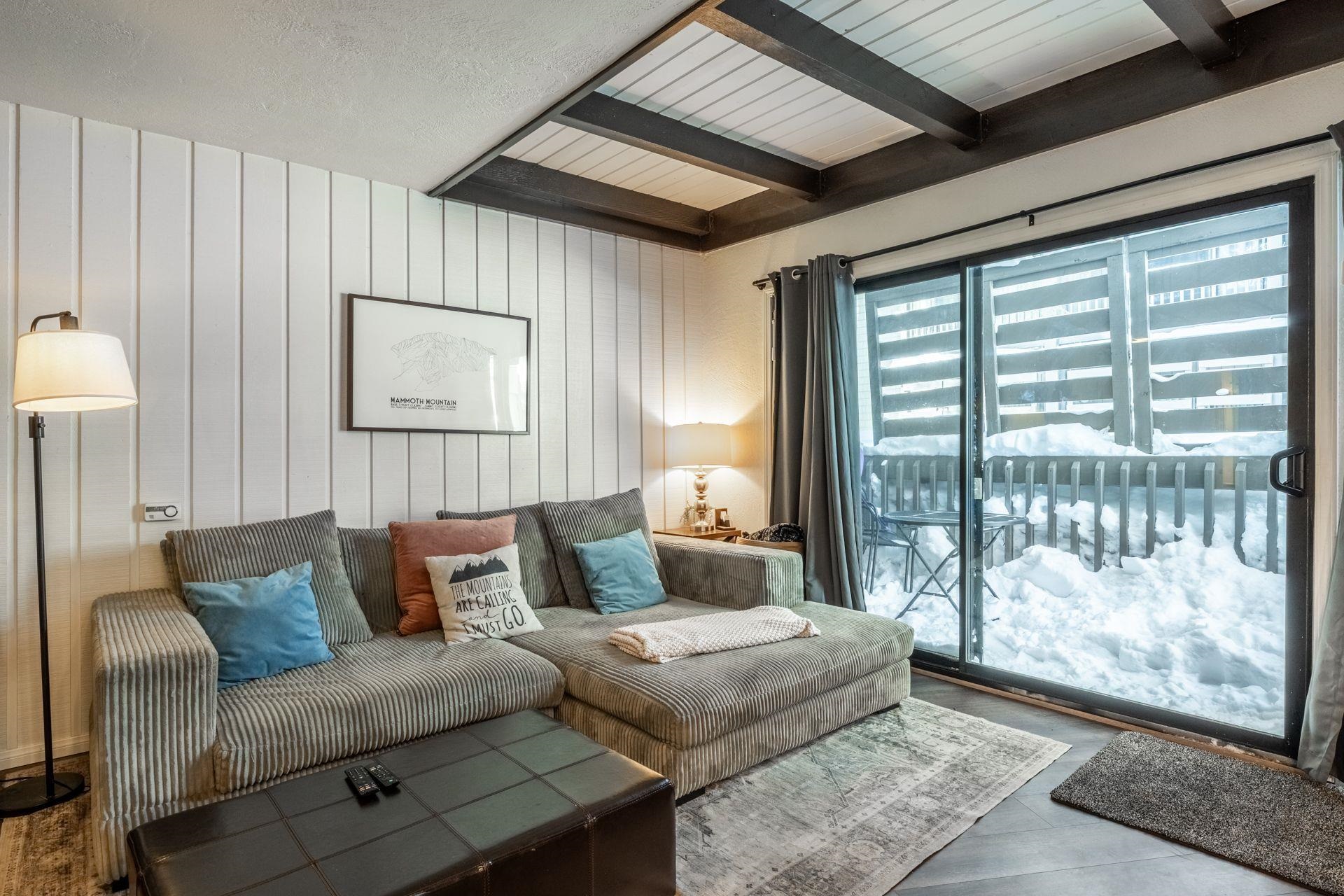 286 Old Mammoth Road, Unit 71 Mammoth Lakes, CA 93546 - Photo 9 of 24 a bedroom with furniture and a large window