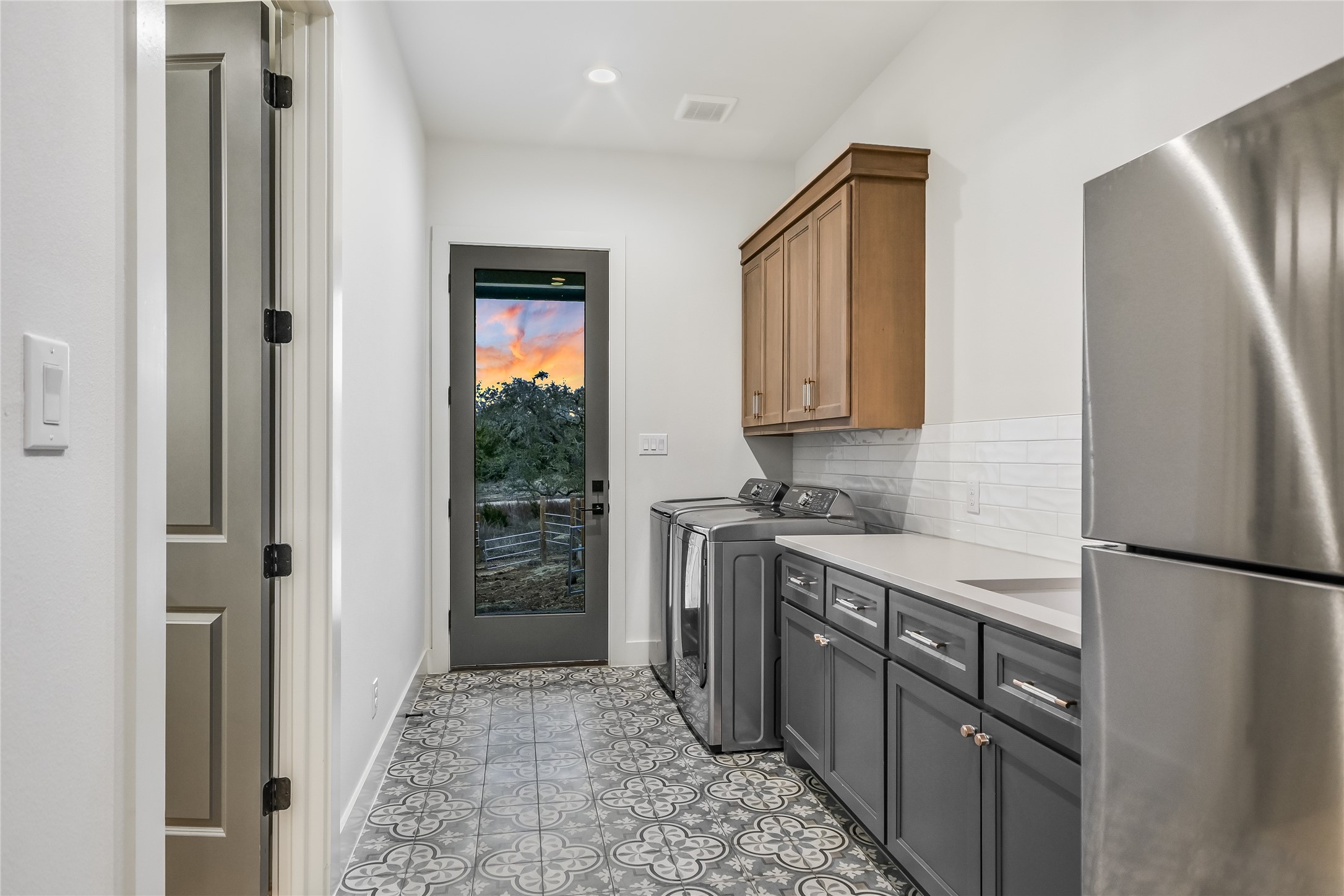 207 Gwendolyns Trail Wimberley, TX 78676 - Photo 17 of 40 a kitchen with stainless steel appliances granite countertop a refrigerator and a stove