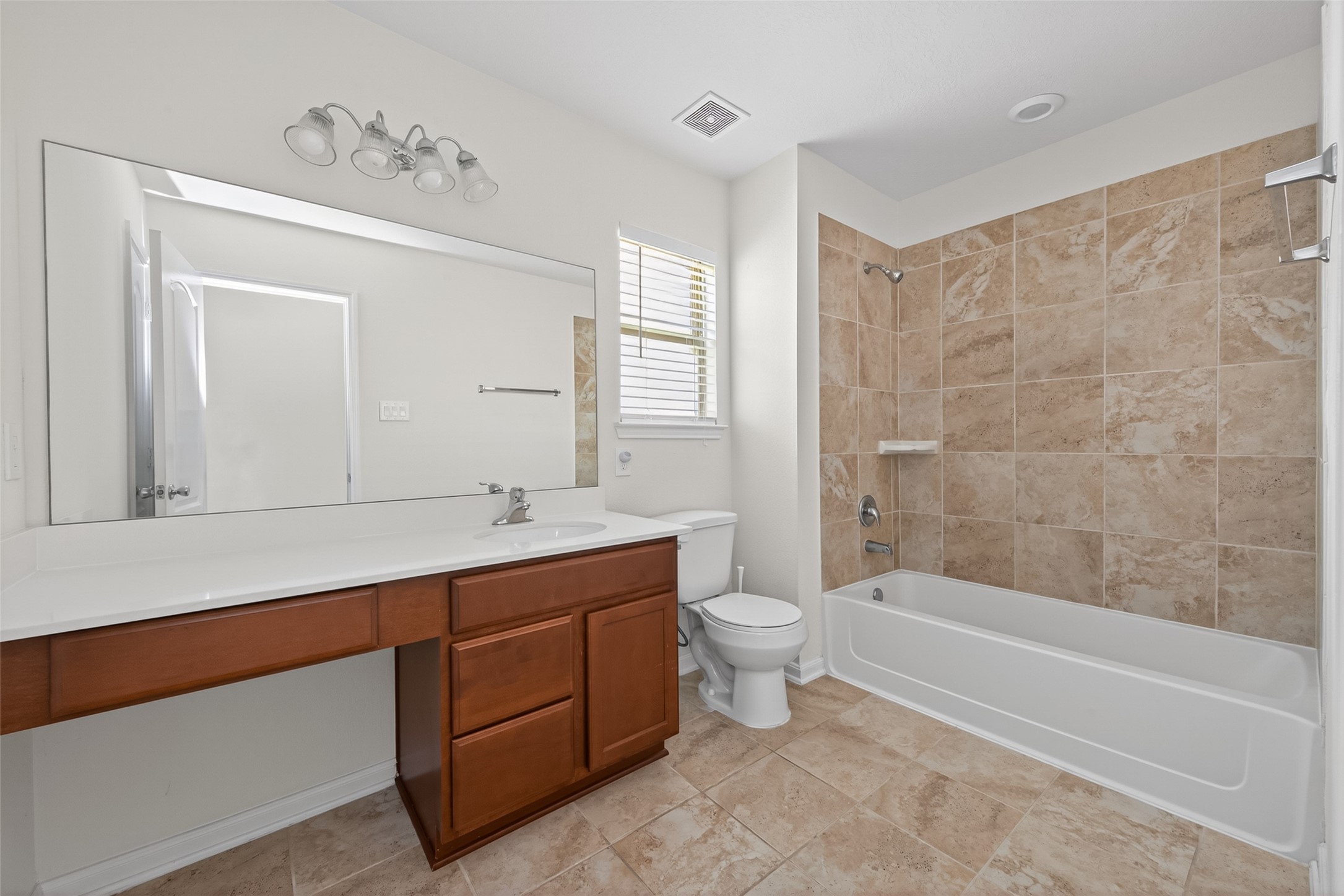 2754 Cayden Creek Way Conroe, TX 77304 - Photo 20 of 40 a bathroom with a bathtub shower sink mirror and toilet