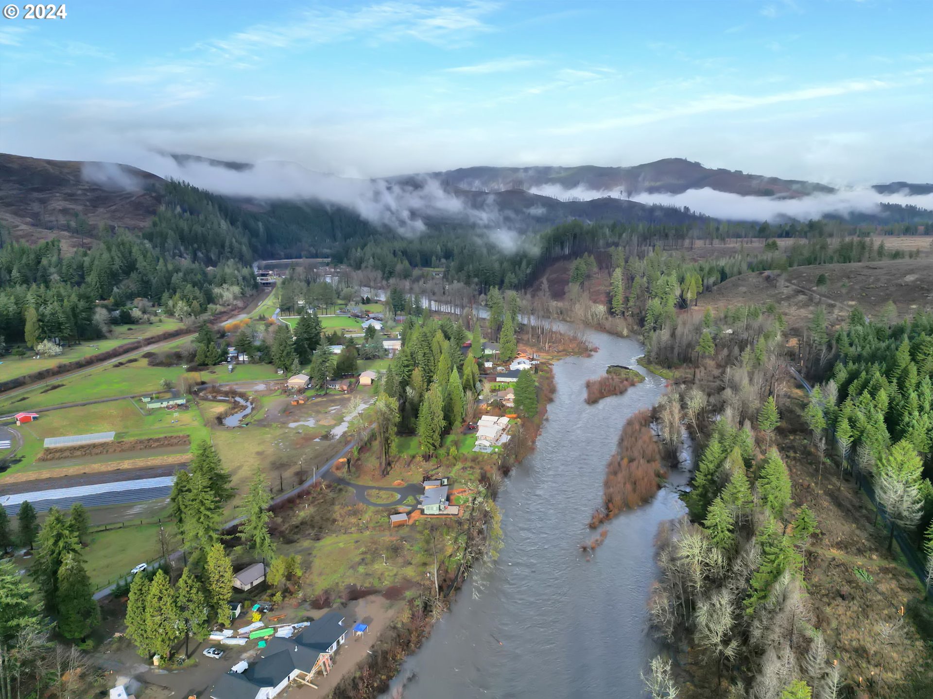 90409 Mountain View Lane Leaburg, OR 97489 - Photo 12 of 18 an aerial view of green landscape with trees houses and mountain view