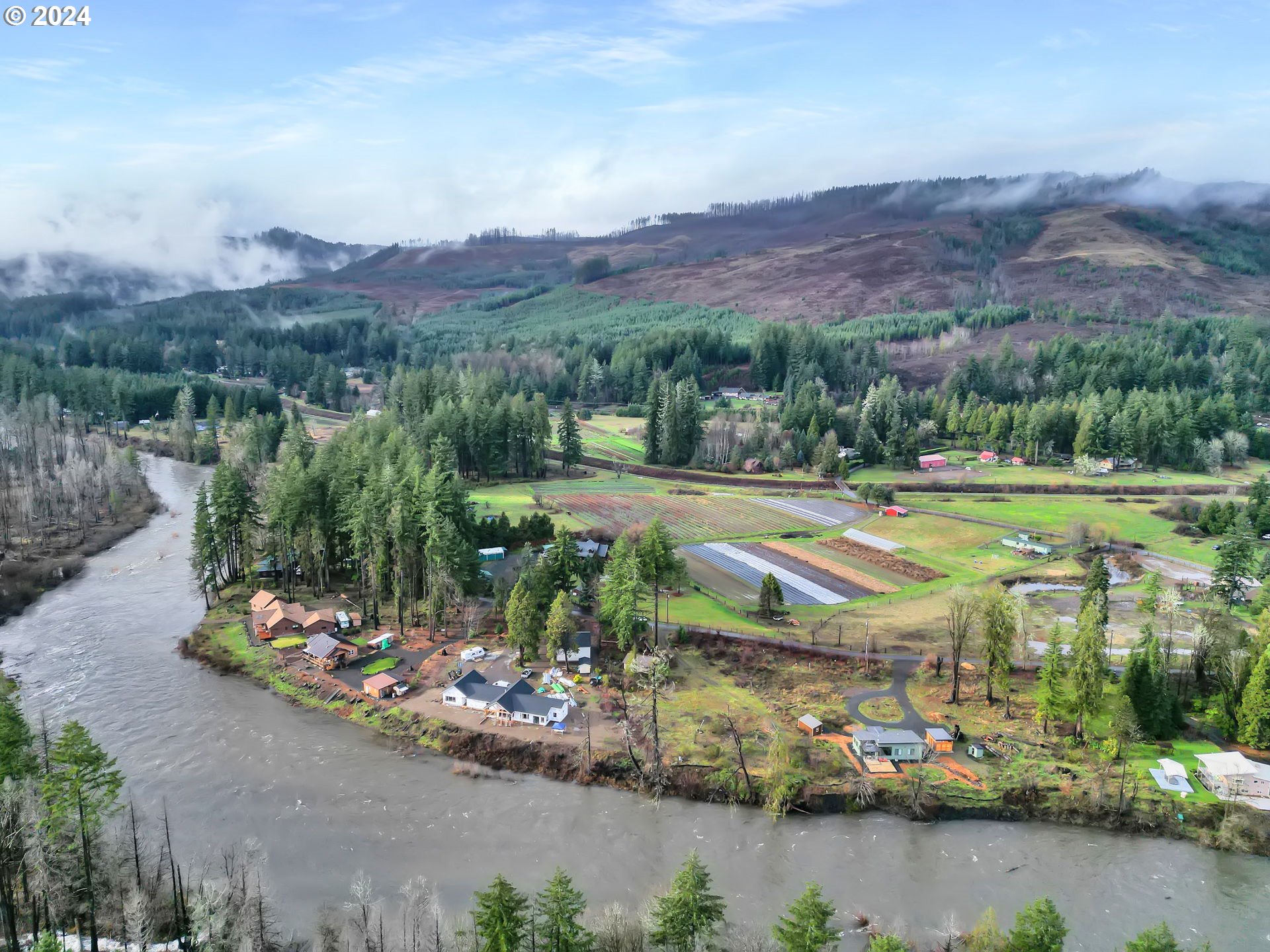 90409 Mountain View Lane Leaburg, OR 97489 - Photo 4 of 18 an aerial view of a town with swimming pool and mountains