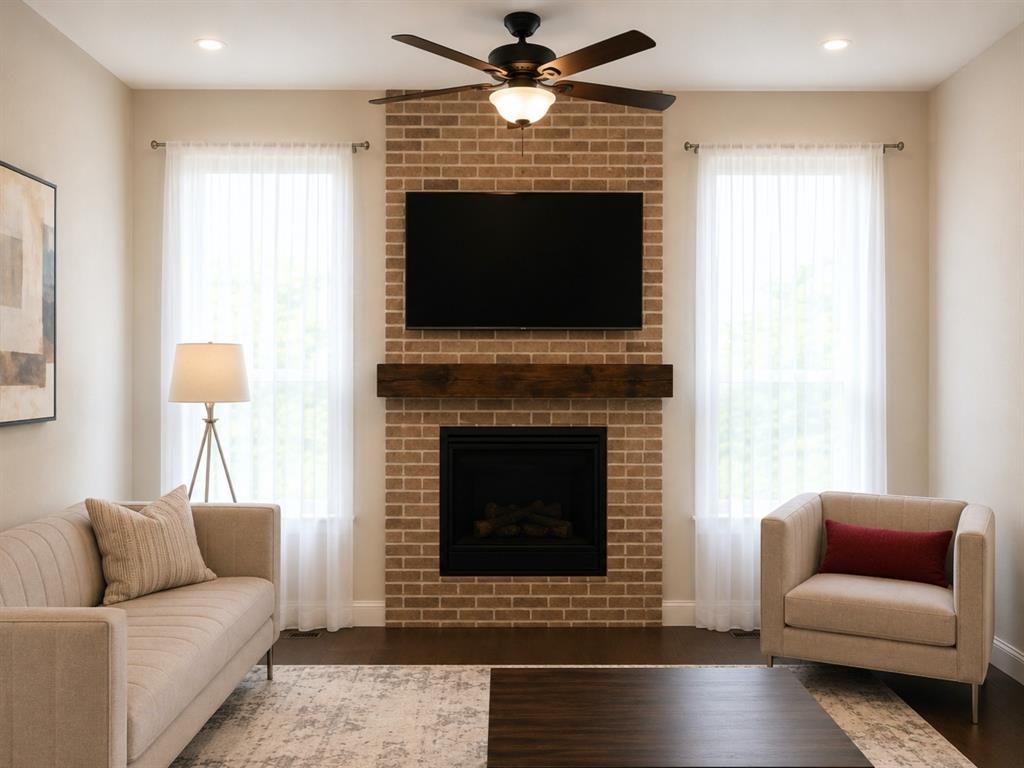 8235 Snapdragon Way Dallas, TX 75252 - Photo 10 of 29 Brick-surround fireplace with a substantial wood mantel