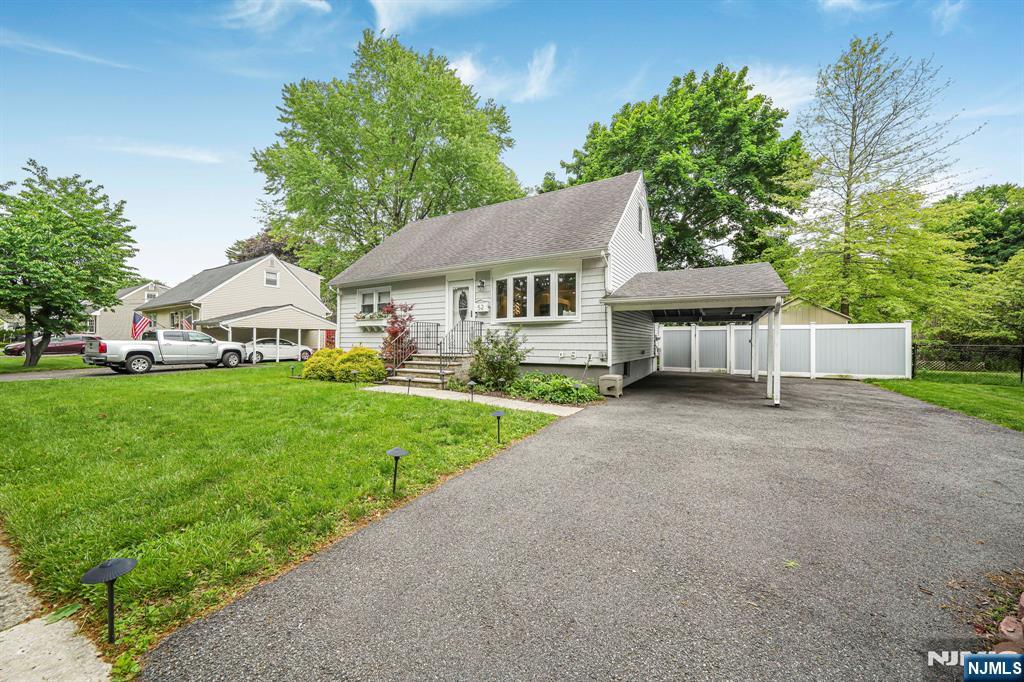 52 Barbara Drive Pompton Lakes, NJ 07442 - Photo 3 of 30 a view of house with garden and tall trees