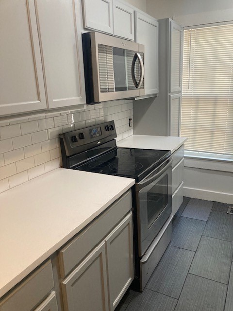 2710 Whitis Avenue, Unit A Austin, TX 78705 - Photo 12 of 20 a kitchen with a stove and a microwave