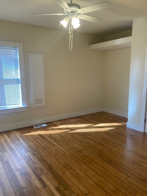 2710 Whitis Avenue, Unit A Austin, TX 78705 - Photo 16 of 20 a view of a room with wooden floor and fan