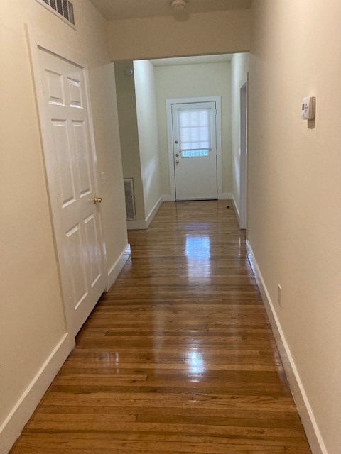 2710 Whitis Avenue, Unit A Austin, TX 78705 - Photo 18 of 20 a view of an empty room with wooden floor and a window