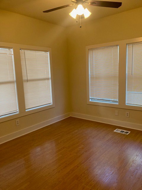 2710 Whitis Avenue, Unit A Austin, TX 78705 - Photo 19 of 20 a view of an empty room with a window and wooden floor