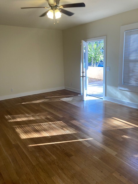 2710 Whitis Avenue, Unit A Austin, TX 78705 - Photo 3 of 20 a view of an empty room with a window and wooden floor