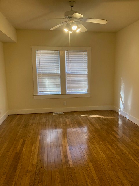 2710 Whitis Avenue, Unit A Austin, TX 78705 - Photo 9 of 20 a view of an empty room with wooden floor and a window