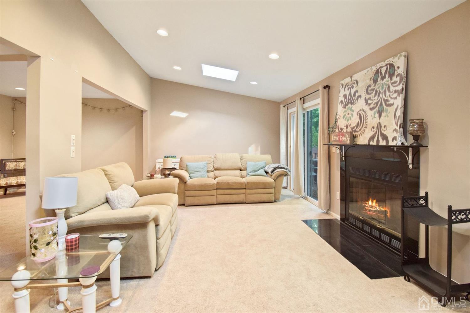 119 Redpine Loop Old Bridge, NJ 08857 - Photo 3 of 15 a living room with furniture and a flat screen tv