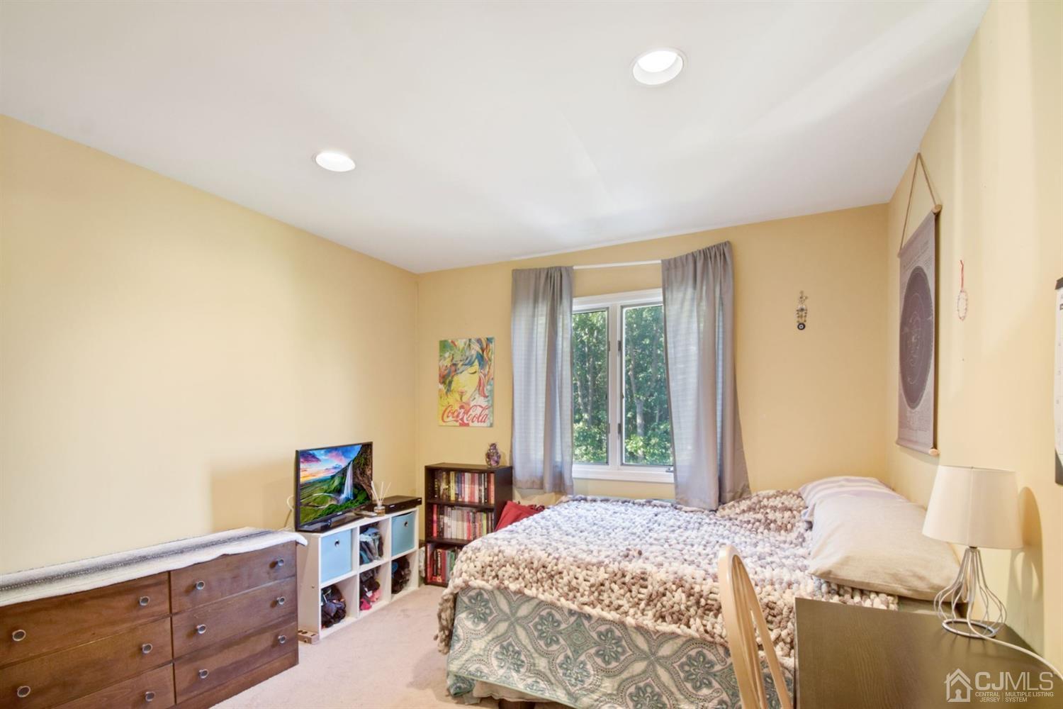119 Redpine Loop Old Bridge, NJ 08857 - Photo 8 of 15 a bedroom with a bed and a window