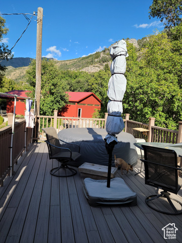 97 East Main Street Stockton, UT 84071 - Photo 14 of 58 Deck featuring a mountain view and outdoor dining area