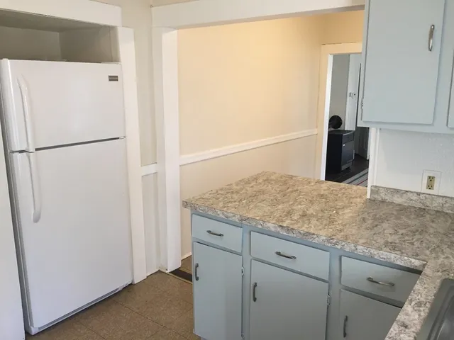 a view of granite countertop cabinets washer and dryer
